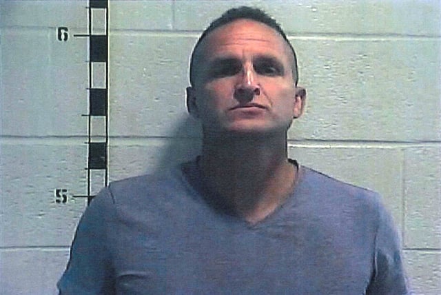 Former Louisville police detective Brett Hankison poses for a booking photograph at Shelby County Detention Center in Shelbyville, Kentucky, U.S. September 23, 2020. Picture taken September 23, 2020.  Shelby County Detention Center/Handout via REUTERS/File Photo