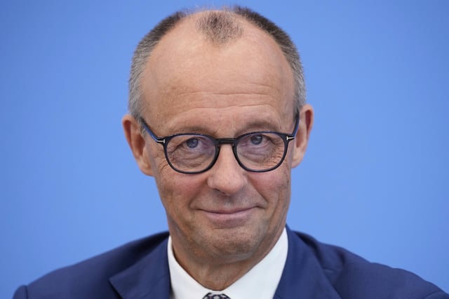 German Chancellor Friedrich Merz attends the annual press conference at the Federal Press Conference in Berlin, Germany, Friday, July 18, 2025. (AP Photo/Ebrahim Noroozi)