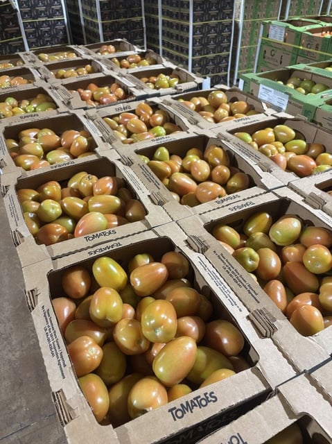 Crates of Roma tomatoes from Mexico are staged for shipment in the Divine Flavor warehouse in Nogales, Arizona. This is one of hundreds of specialized temperature controlled warehouses in southern Arizona that handle tomatoes from Mexico.