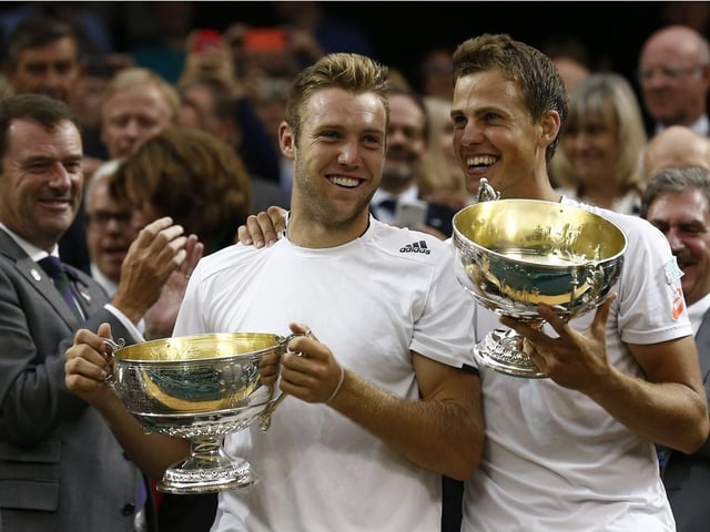  Vasek Pospisil (right) and Jack Sock celebrate 2014 Wimbledon doubles title at The All England Tennis Club.