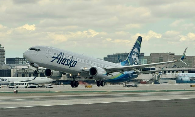 An Alaska airlines Boeing 737 takes off from Los Angeles International Airport  in Los Angeles, California, on March 6, 2024.