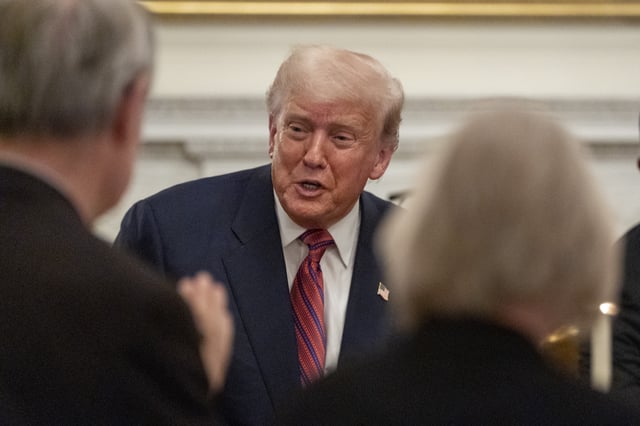 President Donald Trump greets supporters during a dinner for Republican senators in the State Dining Room of the White House, Friday, July 18, 2025, in Washington. (AP Photo/Alex Brandon)