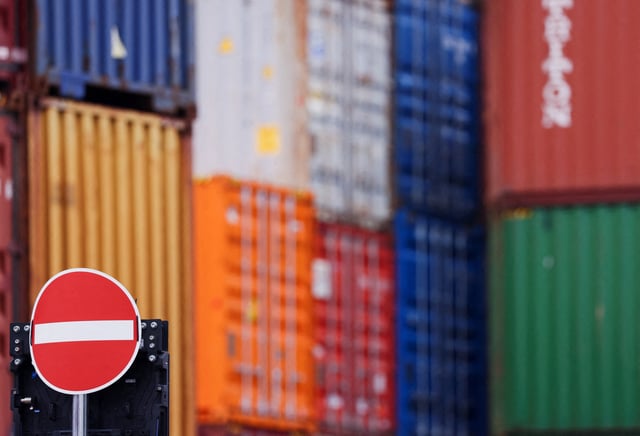Containers are stacked behind a no entry sign, after U.S. President Donald Trump threatened on Saturday to impose a 30% tariff on imports from Mexico and the European Union starting on August 1, in the harbour of Duisburg, Germany, July 14, 2025. REUTERS/Thilo Schmuelgen/File Photo