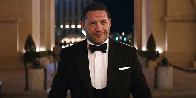 Tom Hardy walks into a fancy place wearing a tux in 'Venom: The Last Dance' 