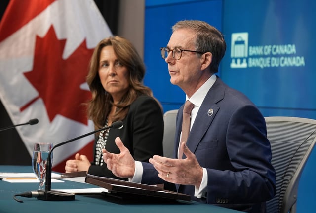 Bank of Canada Senior Deputy Governor Carolyn Rogers looks on as Governor Tiff Macklem speaks during a news conference, in Ottawa, Wednesday, June 4, 2025. A pair of reports from the Bank of Canada say tariff-related uncertainty continued to put a damper on business and consumer sentiment in the second quarter, but the worst-case trade scenarios previously anticipated seem less likely. THE CANADIAN PRESS/Adrian Wyld
