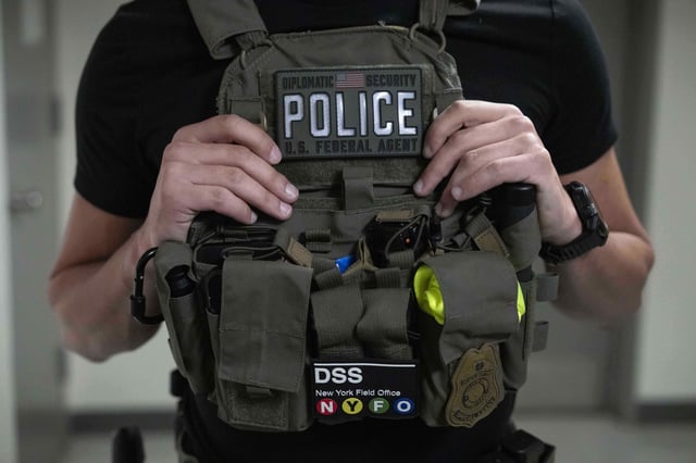 Federal agents stand outside an immigration court at the Jacob K. Javits federal building, Thursday, July 17, 2025, in New York.