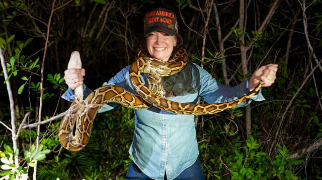 Secretary of Agriculture Brooke Rollins posing with a python from her python hunt in the Everglades on July 20, 2025.