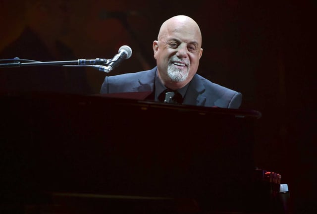 Musician Billy Joel performs during his 100th lifetime performance at Madison Square Garden on July 18, 2018, in New York. Joel says he&#39;s &#34;feeling fine&#34; but still recovering after being diagnosed with normal pressure hydrocephalus, a brain disorder that led him to cancel his 2025 tour dates.