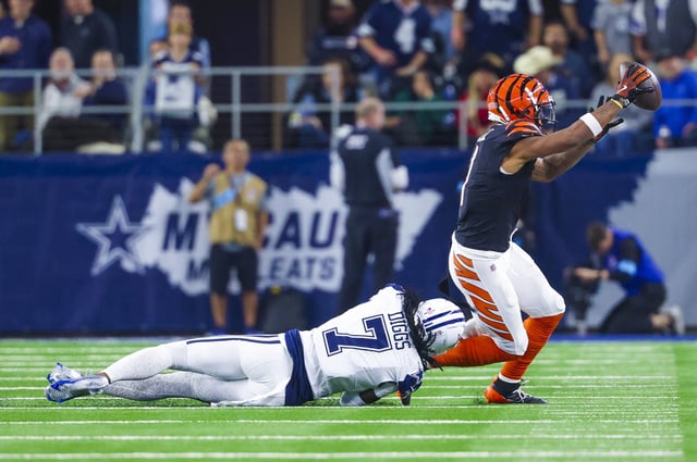 Dec 9, 2024; Arlington, Texas, USA;  Cincinnati Bengals wide receiver Ja'Marr Chase (1) catches a pass as Dallas Cowboys cornerback Trevon Diggs (7) defends during the second half at AT&T Stadium. Mandatory Credit: Kevin Jairaj-Imagn Images/File Photo