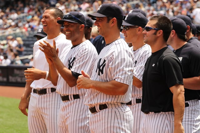 NEW YORK, NY - JUNE 26:  Alex Rodriguez #13, Mariano Rivera #42, Jorge Posada #20, and Nick Swisher #33 of the New York Yankees cheer on Head Trainer Gene Monohan during a retirement ceremony before the New York Yankees 65th Old Timers Day game on June 26, 2011 at Yankee Stadium in the Bronx borough of New York City.  (Photo by Al Bello/Getty Images)