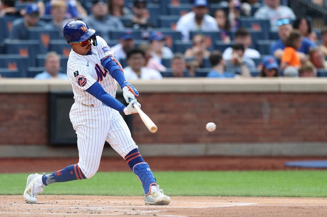 NEW YORK, NEW YORK - JULY 19: Mark Vientos #27 of the New York Mets hits an RBI single during the first inning against the Cincinnati Reds at Citi Field on July 19, 2025 in the Queens borough of New York City.