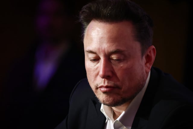 Tesla CEO Elon Musk faces scrutiny as a top analyst makes a surprise move ahead of earnings