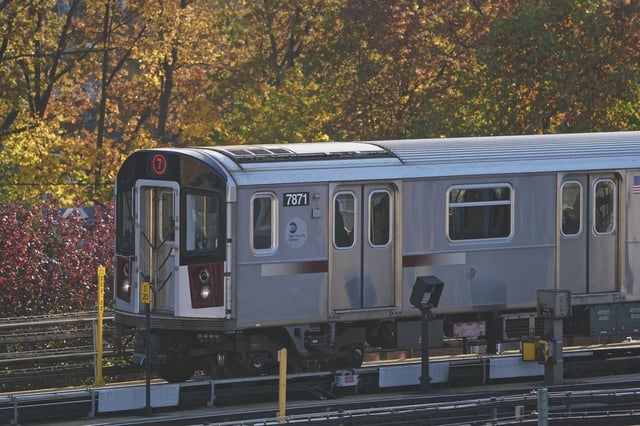 A 7 train runs on an elevated subway track in 2018.