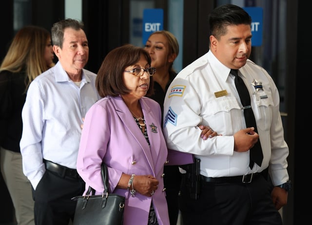 Rodrigo Vásquez, from left, and Rocio Lasso, the parents of slain Chicago police Officer Andrés Mauricio Vásquez Lasso, leave the Leighton Criminal Court Building, July 15, 2025, after a day in the trial of their son’s accused killer, Steven Montano. (Terrence Antonio James/Chicago Tribune)