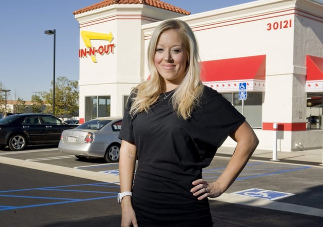 In-In-Out Burger president Lynsi Snyder stands outside a new restaurant in Rancho Santa Margarita in 2013. (LEONARD ORTIZ, ORANGE COUNTY REGISTER)
