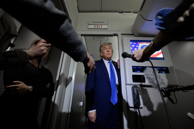 President Donald Trump talks to reporters on board Air Force One after leaving early from the G7 Leaders' Summit on June 16, in Calgary, Alberta.