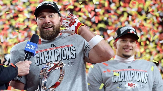 Kansas City Chiefs tight end Travis Kelce (87) reacts on stage after the AFC Championship game against the Buffalo Bills at GEHA Field at Arrowhead Stadium on Jan. 26, 2025.