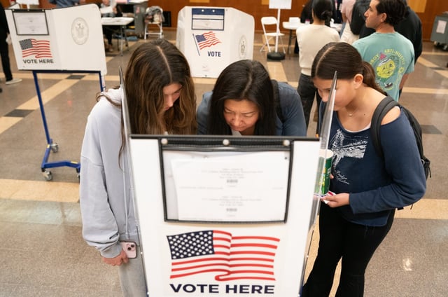 (L-R) Zadie Zimmerman, 15, Helen Zimmerman, and Snow Zimmerman, 11, vote together at FIT  Tuesday Nov. 5, 2024 in New York, New York. (Barry Williams for New York Daily News)