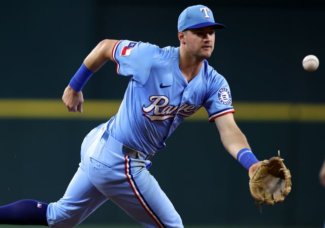 Jun 29, 2025; Arlington, Texas, USA; Texas Rangers third base Josh Jung (6) commits a fielding error during the fourth inning against the Seattle Mariners at Globe Life Field. Mandatory Credit: Tim Heitman-Imagn Images/File Photo