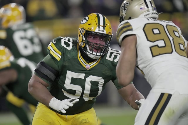 Dec 23, 2024; Green Bay, Wisconsin, USA;  Green Bay Packers guard Zach Tom (50) blocks New Orleans Saints defensive end Payton Turner (98) during the third quarter at Lambeau Field. Mandatory Credit: Mark Hoffman/Milwaukee Journal Sentinel/Imagn Images/File Photo