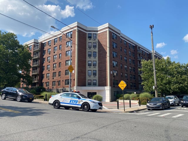 Police vehicles are pictured outside 195 Steuben St. in Staten Island on Monday, July 21, 2025, after a man put a 1-year-old baby girl inside a garbage chute in the building. (Rose Abuin / New York Daily News)