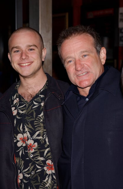 Zak Williams, left, poses with his father Robin Williams at the premiere of "Death to Smoochy" at the Ziegfeld Theater in New York City on March 26, 2002.