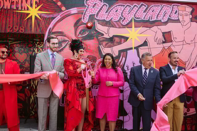Simo´n Malvaez, left, Senator Scott Wiener, D’Arcy Drollinger, then-Mayor London Breed, Supervisor Matt Dorsey and Roberto Ordenana cut the ribbon in front of the completed mural “Showtime” at Oasis on June 2, 2022.