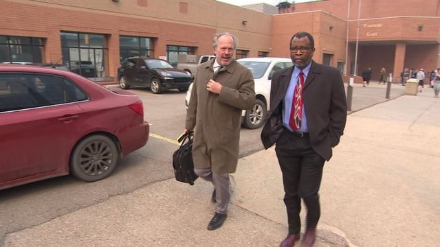 John Olubobokun, right, was found guilty of nine counts of assault with a weapon dating back to when he was the director at Christian Centre Academy for four years starting in 2003. Here he leaves the courthouse with his lawyer Ron Piche after the verdicts were announced on Monday.