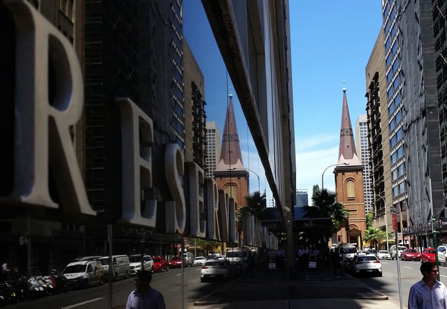 Pedestrians walk past the Reserve Bank of Australia building in central Sydney, Australia, February 10, 2017. REUTERS/Steven Saphore/ File Photo