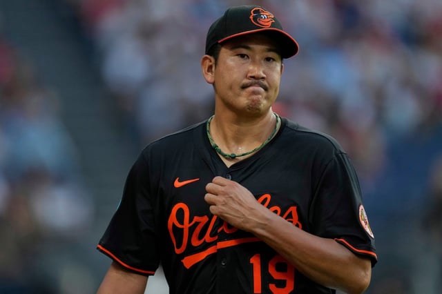 Baltimore Orioles&#39; Tomoyuki Sugano (19) walks off the field after being taken out of the game in the fourth inning of a baseball game against the Cleveland Guardians in Cleveland, Monday, July 21, 2025. (AP Photo/Sue Ogrocki)