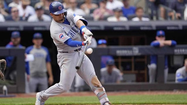 Chicago Cubs right fielder Seiya Suzuki hits a double against the New York Yankees during the seventh inning at Yankee Stadium.