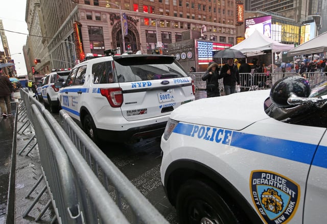 FILE - A line of police cars are parked along a street in Times Square, Thursday, Dec. 29, 2016, in New York.