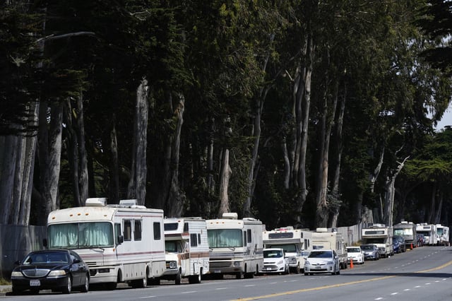 Parked RVs are seen on Lake Merced Boulevard in San Francisco, Tuesday, July 15, 2025. (AP Photo/Godofredo A. Vásquez)