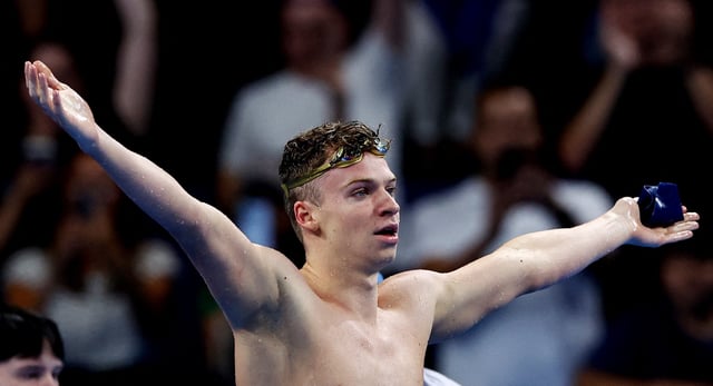 Swimming - Men's 200m Individual Medley Final - Paris La Defense Arena, Nanterre, France - August 02, 2024. Leon Marchand of France celebrates after setting an Olympic record to win gold REUTERS/Ueslei Marcelino/File Photo