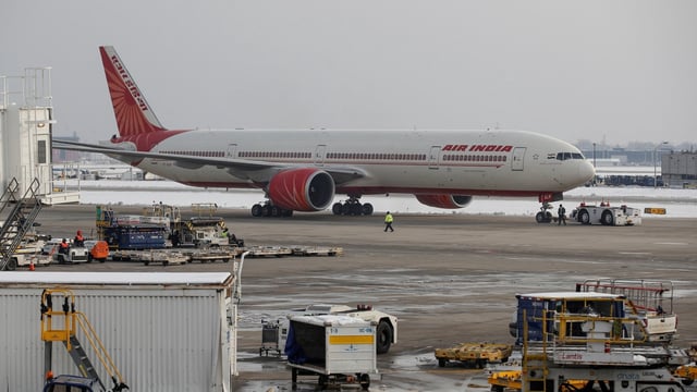 An Air India Boeing 777-300ER plane is towed at O'Hare International Airport in Chicago, Illinois, United States.
