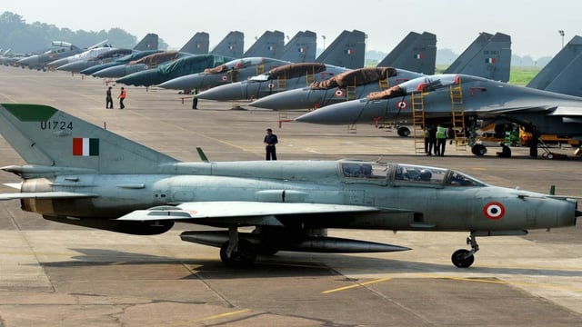 (File) An Indian Air Force MIG-21 passes near Sukhoi-30 fighter jets. AFP 