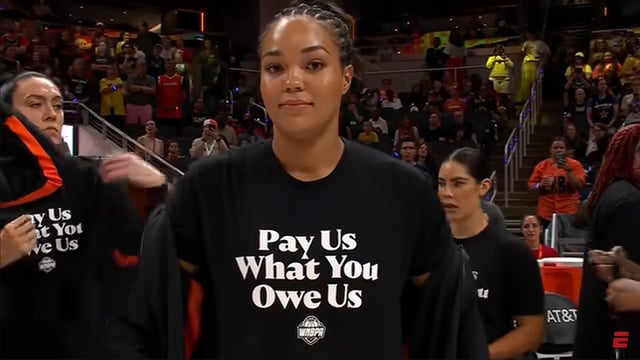 WNBA player wearing a stupid shirt.