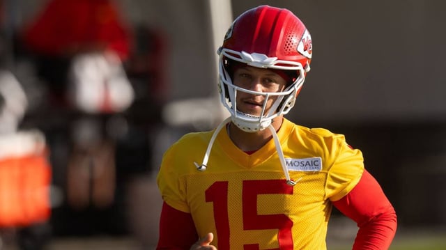 Kansas City Chiefs quarterback Patrick Mahomes (15) stretches before the last training camp practice on Thursday, Aug. 15, 2024, in St. Joseph.