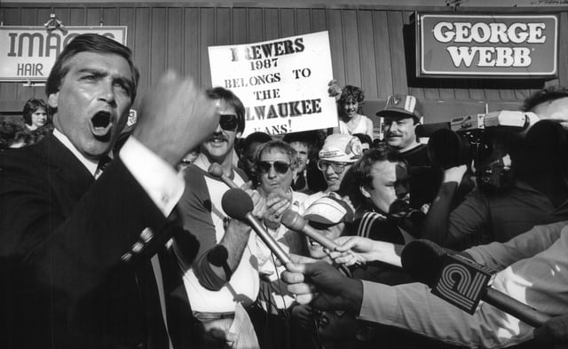 George Webb president David Stamm (above left) put in an extra cheer for the Milwaukee Brewers in April 1987, as he announced the restaurant's plans to pay off on a long-standing prediction by company founder George Webb that the hometown team would win 12 games in a row.