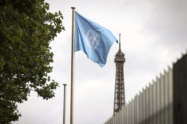 The UNESCO flag flies at its headquarters Tuesday, July 22, 2025 in Paris. (AP Photo/Thomas Padilla)