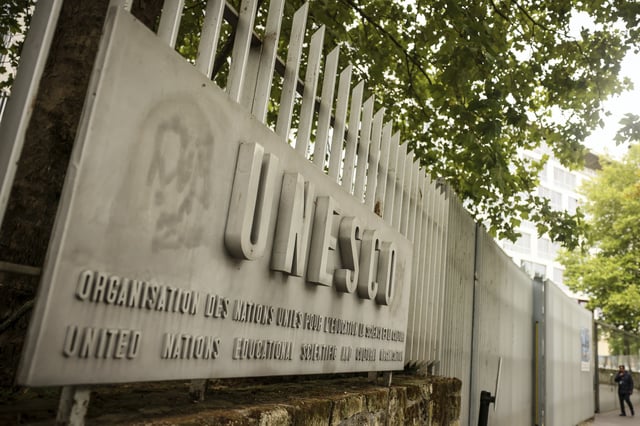 A man enters the UNESCO headquarters Tuesday, July 22, 2025 in Paris. (AP Photo/Thomas Padilla)