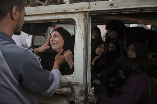 Palestinians mourn their relatives killed from an Israeli army bombardment of Gaza, at Shifa Hospital in Gaza City Tuesday, July 22, 2025. (AP Photo/Jehad Alshrafi)