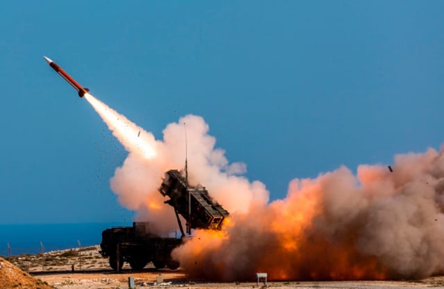FILE – In this image released by the U.S. Department of Defense, German soldiers assigned to Surface Air and Missile Defense Wing 1, fire the Patriot weapons system at the NATO Missile Firing Installation, in Chania, Greece, on Nov. 8, 2017. U.S. officials say the Pentagon is expected to announce that it will provide about $6 billion in long-term military aid to Ukraine. It will include much sought after munitions for Patriot air defense systems and other weapons. (Sebastian Apel/U.S. Department of Defense, via AP, File)