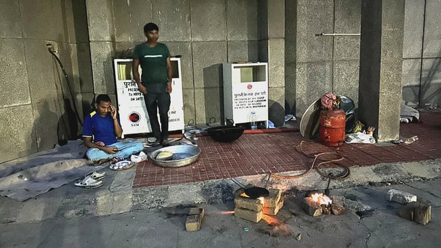 People outside a shelter home in Gurugram