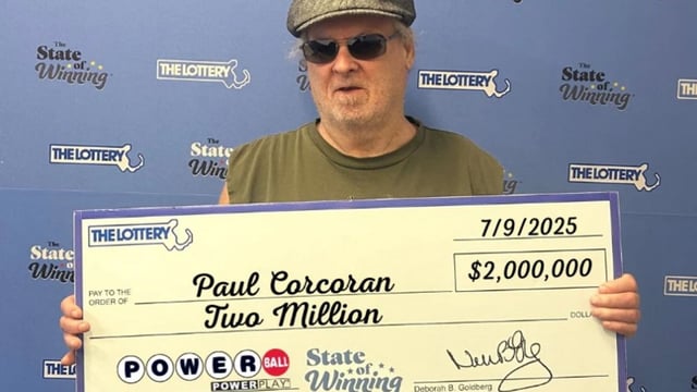 Man holing a cheque