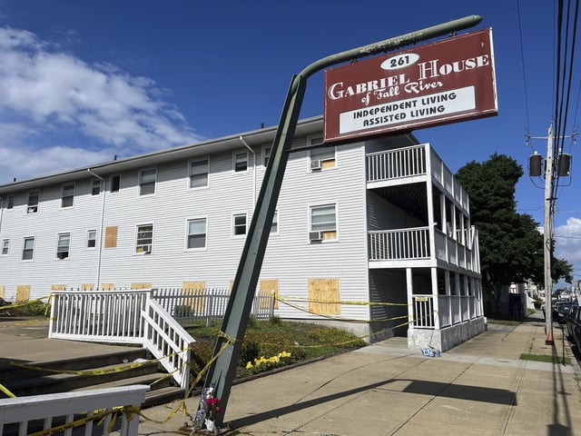 FILE - Boards cover the windows of the Gabriel House assisted living facility, July 15, 2025 in Fall River, Mass. (AP Photo/Kimberlee Kruesi, file)