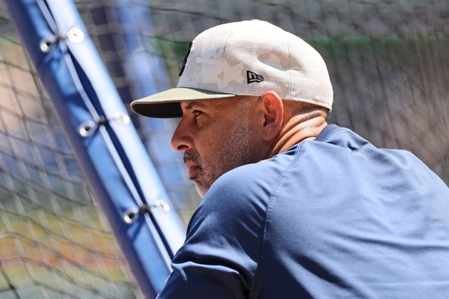 CHICAGO, ILLINOIS - JULY 18: Manager Alex Cora #13 of the Boston Red Sox looks on during batting practice prior to the game against the Chicago Cubs at Wrigley Field on July 18, 2025 in Chicago, Illinois.