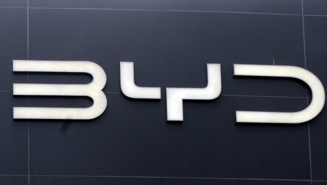 A BYD showroom signboard is seen in Colombo, Sri Lanka, on July 18, 2025. BYD, the Chinese electric vehicle giant, rapidly expands its presence in Sri Lanka. It opens its fifth dealership in Ampara and rolls out significant price reductions across popular models, making EVs more accessible to Sri Lankan consumers. The company also introduces its luxury brand, Denza, aiming to cater to both premium and mainstream segments. This expansion aligns with a growing interest in sustainable transportation following the recent lifting of import restrictions. Sri Lanka's economic outlook shows steady improvement. With restrictions eased earlier this year, consumer confidence begins to rebuild. The Sri Lankan rupee stabilizes, signaling healthier fiscal management, while the tourism sector experiences a revival as international arrivals rise. These developments bring renewed optimism across industries. In the education sector, a digital transformation is underway. Starting in August, the Ministry of Education rolls out a pilot initiative to digitize rural schools. Tablets are distributed and Wi-Fi networks installed, laying the groundwork for more inclusive, tech-forward learning environments. This effort marks a significant step toward bridging the urban-rural educational divide. (Photo by Akila Jayawardena/NurPhoto via Getty Images)