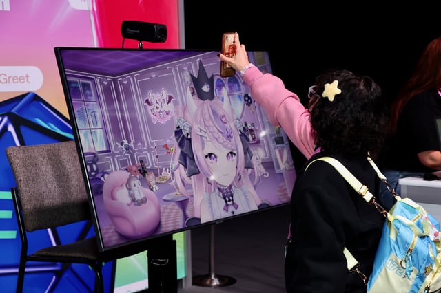 Attendee meets VTuber Ironmouse at TwitchCon 2024 San Diego on September 20, 2024 in San Diego, California.