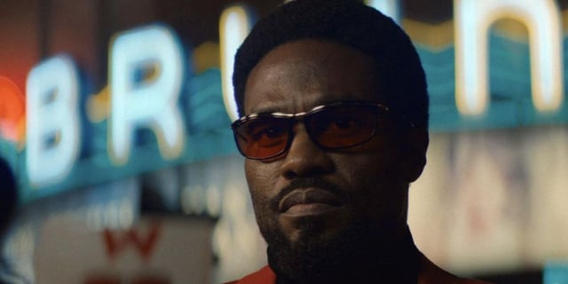 Yahya Abdul-Mateen II as Wonderman wearing sunglasses and staring ahead intently.